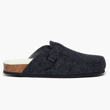 A coal wool felt slipper with a adjustable strap and a cork insole, on a white background. Handmade in Spain.